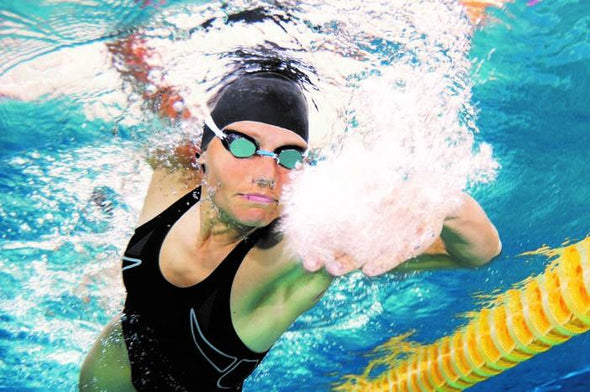 woman swimming in competition